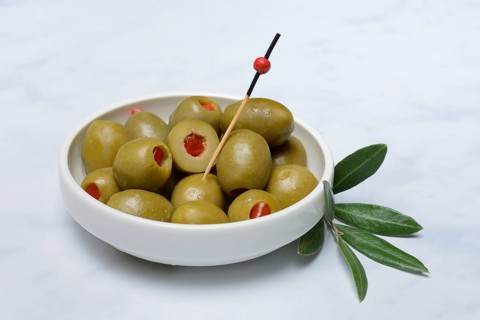 Green olives stuffed with pieces of paprika