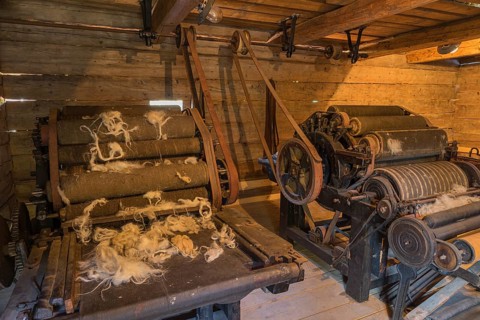 Machine for wool processing. Open-air museum in Roznov pod Radhostem, displaying buildings and