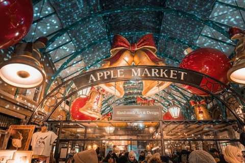View of Apple Market entrance with big Christmas bells and lights, AppleMarket, London, United