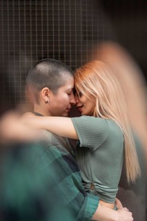 A Colombian lesbian couple shares a tender embrace, symbolizing love, diversity, and acceptance.