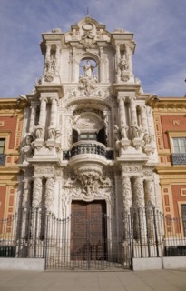 San Telmo palace building facade with columns at the entrance decorated with carved statues and