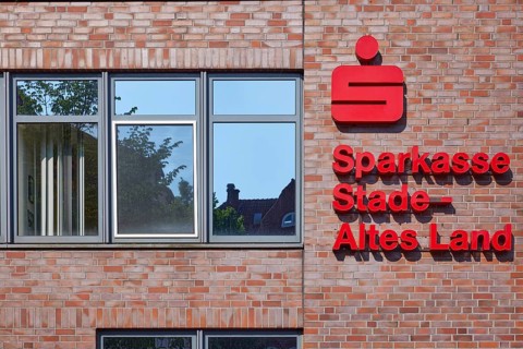 Logo and lettering of Sparkasse Stade-Altes Land on the facade of the branch in Stade, Hanseatic