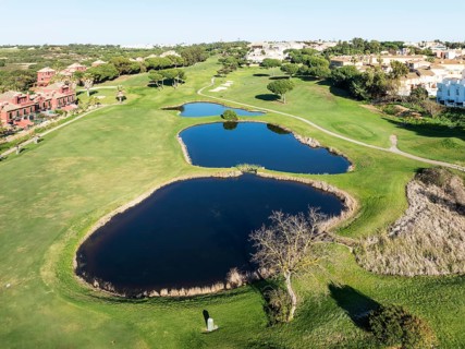 Fairway framed by housing estates at the Islantilla Golf Resort. Aerial view. Drone shot. Huelva