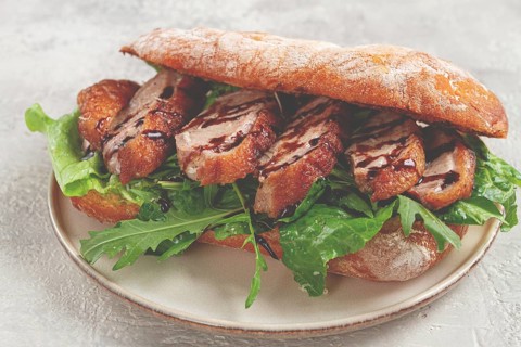Sandwich with duck breast and arugula, balsamic sauce, on a light plate, breakfast, homemade, no