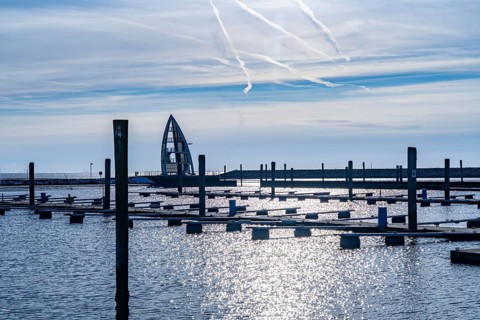 The East Frisian North Sea island of Juist in winter, empty sports harbour, lookout tower