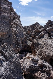 Large, weathered lava rocks under a clear blue sky, Argentina, volcanoes, lava field, Antofagasta
