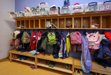 Germany - Symbolic image KITA. Children's coats, jackets and unicorn rucksacks hang on a coat rack