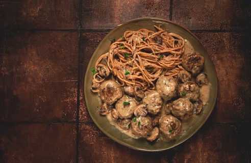 Spaghetti with meatballs and mushrooms, in cream sauce, homemade, no people