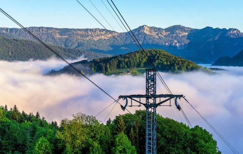 Morning fog over the village of Berchtesgaden in the valley, Bavaria, Germany