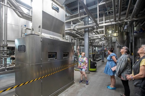 Covington, Louisiana - The Abita Brewing Company's craft beer brewery. A tour guide explains the