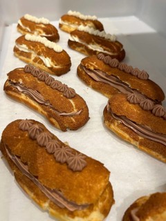 Freshly baked chocolate and vanilla éclairs, Vienna, Austria