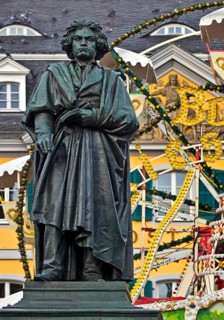 The Beethoven monument in front of the Bonn Christmas market Ferris wheel on Münsterplatz, Bonn,