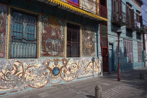 House walls with richly decorated façades and window grilles in historic style, La Boca