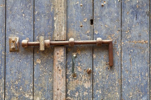 Old door with iron fittings, Agrigento, Sicily, Italy
