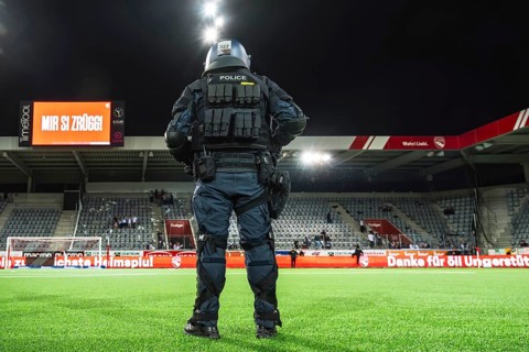 Police officer in combat gear Football stadium
