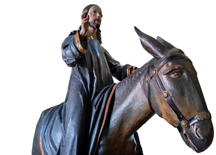 Christ on the palm donkey, detail on white background, wooden figure from around 1880, Dominican
