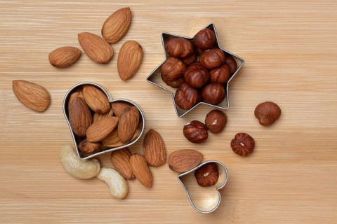 Nuts and cookie cutters, almonds, cashews and hazelnuts