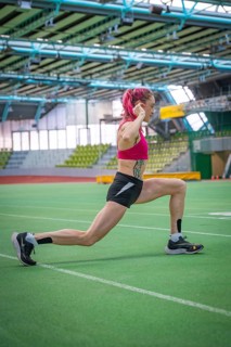 Running athlete in the stadium, demonstrating strength and endurance during training, Glaspalast,
