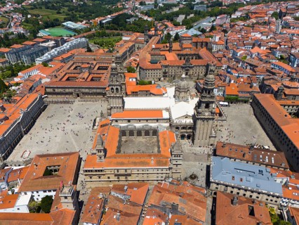 Aerial view of the city centre with a large cathedral and a main square surrounded by historic