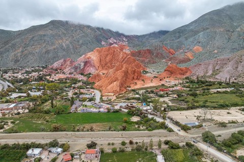 Aerial view of Purmamarca, Jujuy, Argentina, showcasing its vibrant, multicolored hills and