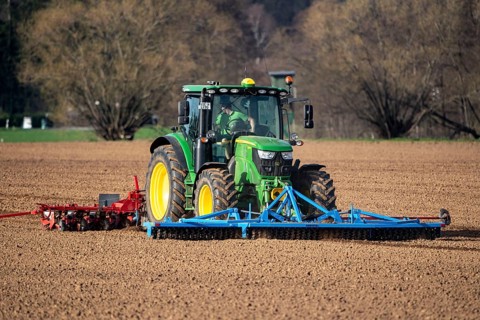 Sugar beet being sown in spring, precision sowing with precision seed drill, behind a tractor,