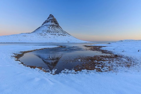 Pointed mountain reflected in fjord at low tide, snow, winter, dawn, Kirkjufell, Snaefellsnes,