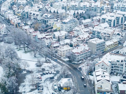 Detailed view of a snow-covered residential neighbourhood with streets and trees, Sindelfingen,