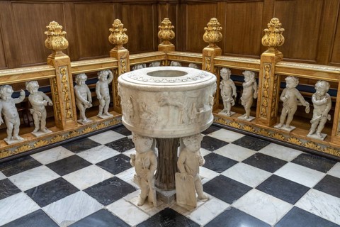 Baptismal font in the interior of the Evangelical Lutheran Church of the Saviour in front of