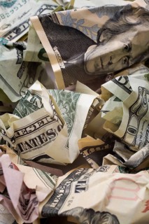 Close-up of pile of discarded crumpled US paper currency bank notes, Studio Composition