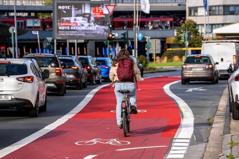 Cycle path, cycle lane, marked in red to draw the attention of motorists to the cycle path, between