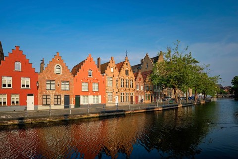 Typical Belgian cityscape Europe tourism concept, canal and old houses on sunset. Bruges (Brugge),