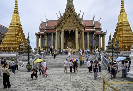 Tourists at Wat Phra Kaew, Temple of the Emerald Buddha, Bangkok, Thailand