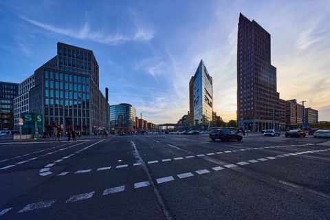 High-rise buildings Forum Tower and Kollhoff Tower in the backlight at Potsdamer Platz in Berlin,
