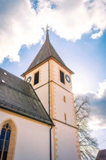 Steeple of a historic church under clear blue sky, Deufringen, Aidlingen, Böblingen district,