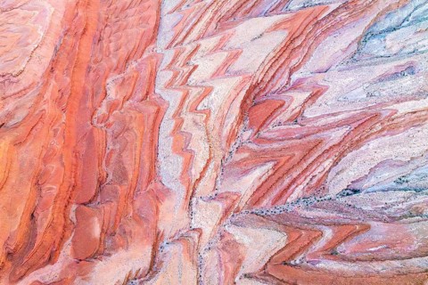 Striking aerial view of the patterned sandstone canyons near the San Juan River in Utah, showcasing