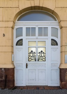 Old door to the old printing house in Rudolf-Breitscheid-Straße, Döbeln, Saxony, Germany
