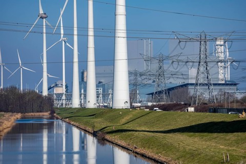 Wind farm and the Eemshaven coal power plant, right, Eemshavencentrale, operated by RWE Generation,