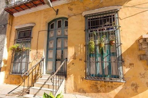 Scenic colorful Old Havana streets in historic city center (Havana Vieja) near Paseo El Prado and