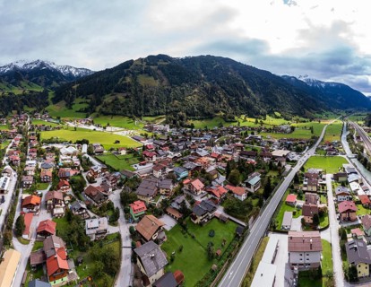 Drone image, residential buildings, view of village with parish church, Dorfgastein, Gasteinertal,