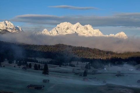 Mountain range in the morning light, fog, snowy, spring, Wetterstein Mountains, Alpspitze,