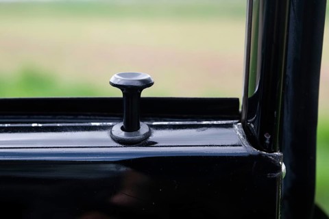 Door lock button, vintage car, black Volvo Amazon, medium class car from Swedish car manufacturer