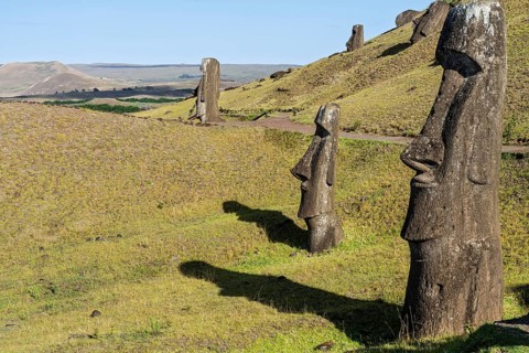 Moai stone statues on the slope of the Rano Raraku volcano, Rapa Nui National Park, Easter Island,