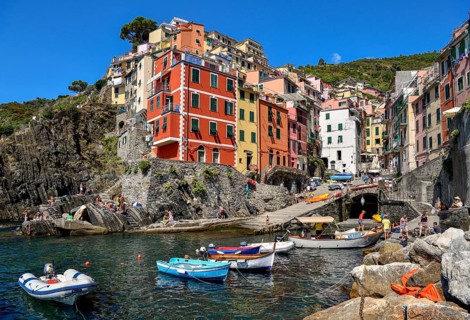 Fishing boats in the harbour of Riomaggiore, village view, Cinque Terre, province of La Spezia,