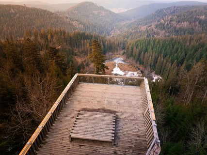 View over wooded hills and valleys from a wooden terrace, Ellbachseeblick viewing platform,