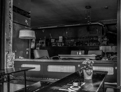 Black and white photograph, view into a bar at the Schlesisches Tor in Berlin, Germany