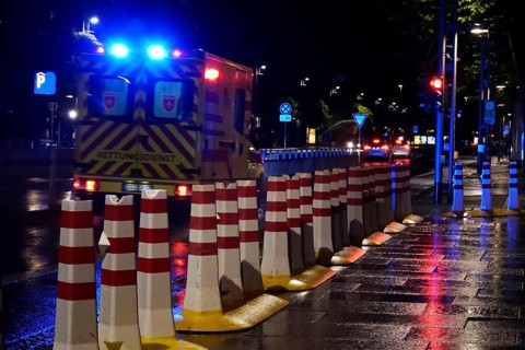 Security barrier for an event, large city at night, Germany
