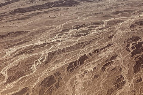 Details of a desert landscape with eye-catching textures and lines, photographed from the air, The