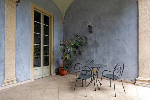 Terrace with table and chairs in the historic centre of Cannobio, Lake Maggiore, province of