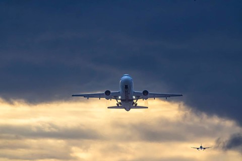 Stuttgart airport with Eurwings aircraft taking off. Behind it, an airplane landing in front of