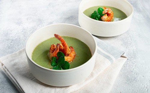 Pea cream soup, with shrimp, green soup, homemade, top view, no people